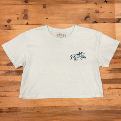 Watersports West x Stoefs Take it easy Women’s Cropped Tee. Women’s Seafoam Surf Tee Shirt. Comes in Extra-Small, Small, Medium, Large.